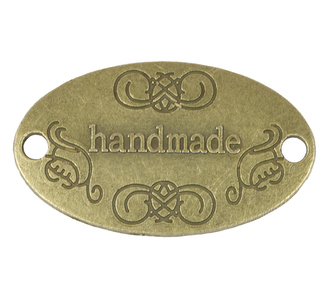 Nášivka Hand Made kovová - bronzová - 32x19 mm