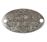 Nášivka Hand Made kovová - stříbrná s černým písmem - 32x19 mm