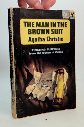 The man in the brown suit