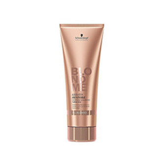 Schwarzkopf Professional Obnovující keratinový šampon pro blonďaté vlasy BLONDME (Keratin Restore Bonding Shampoo) Obnovující keratinový šampon pro blonďaté vlasy BLONDME (Keratin Restore Bonding Shampoo) - Objem 250 ml woman