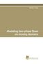 Modeling two-phase flows on moving domains